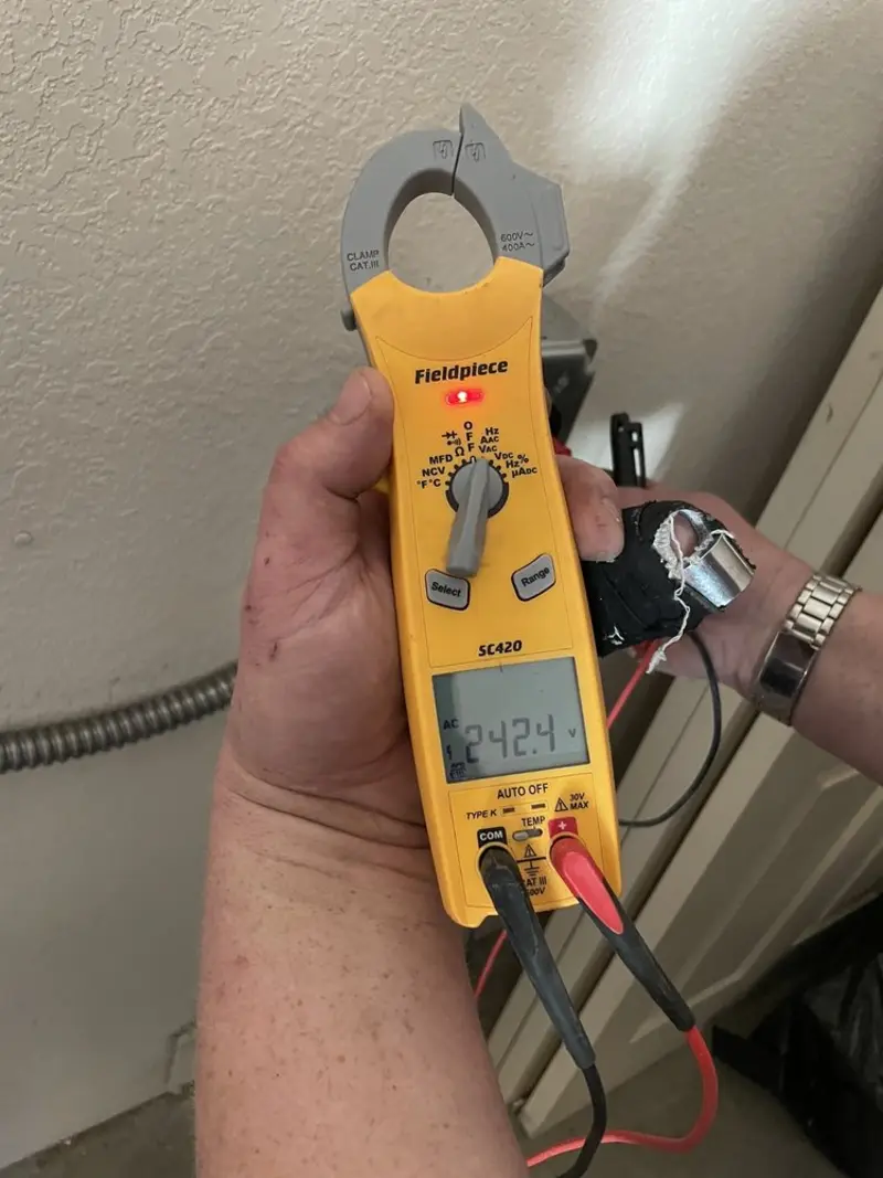 Voltage testing with clamp meter during Generator Installation in North Merritt Island